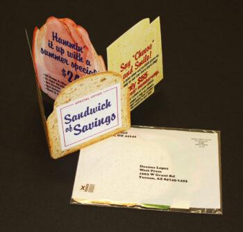 Sandwich Mailer a promotional marketing peice folded in the shape of a sandwich with bread, ham and cheese layers